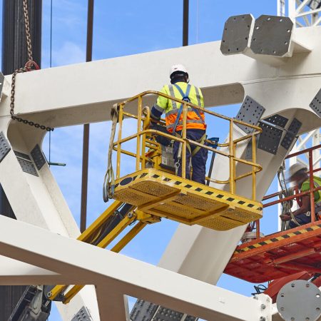 Workers on a construction site. Engineering and architectural infrastructure. Workplace